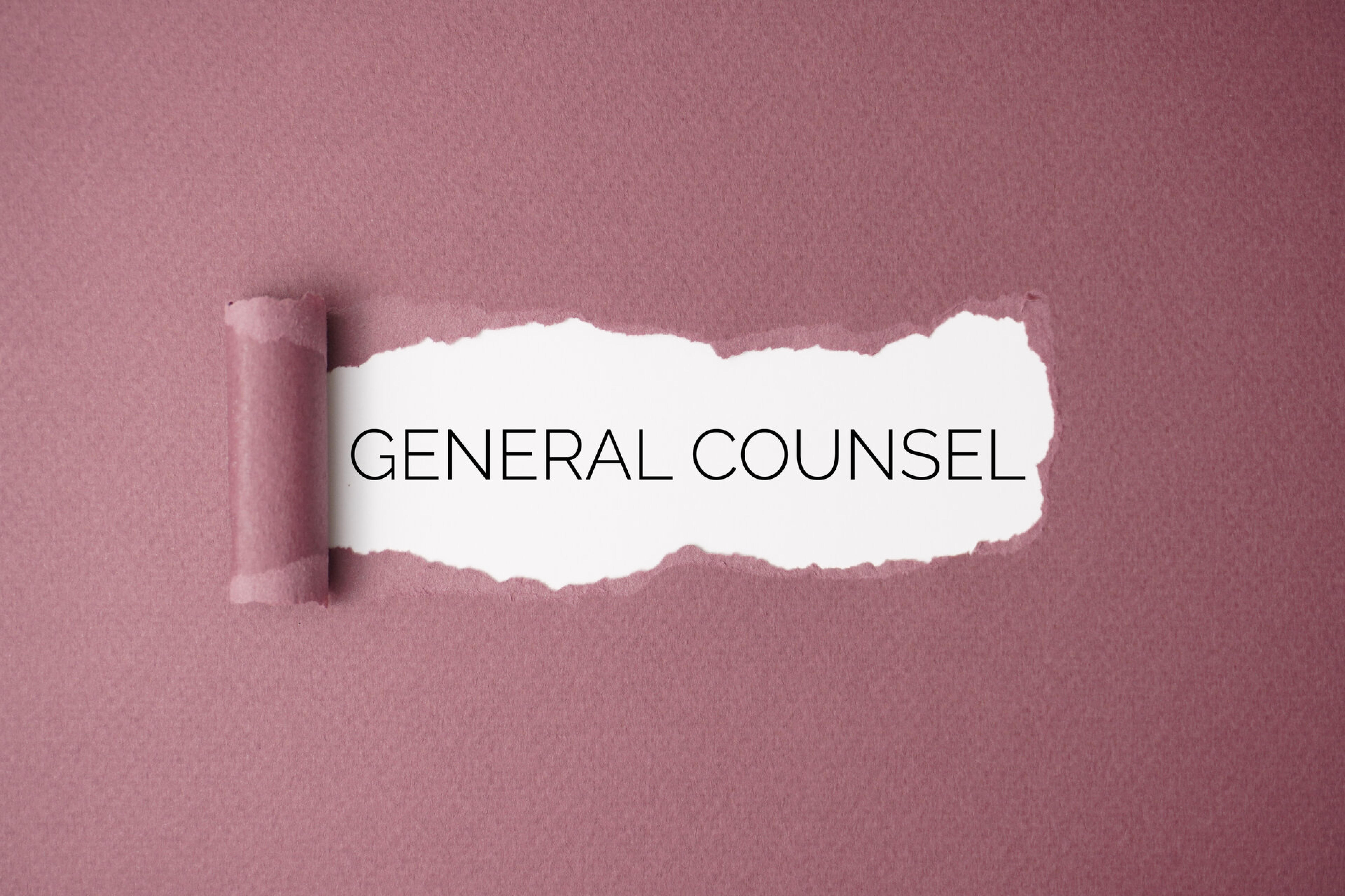 Torn paper revealing the words &ldquo;General Counsel&rdquo;