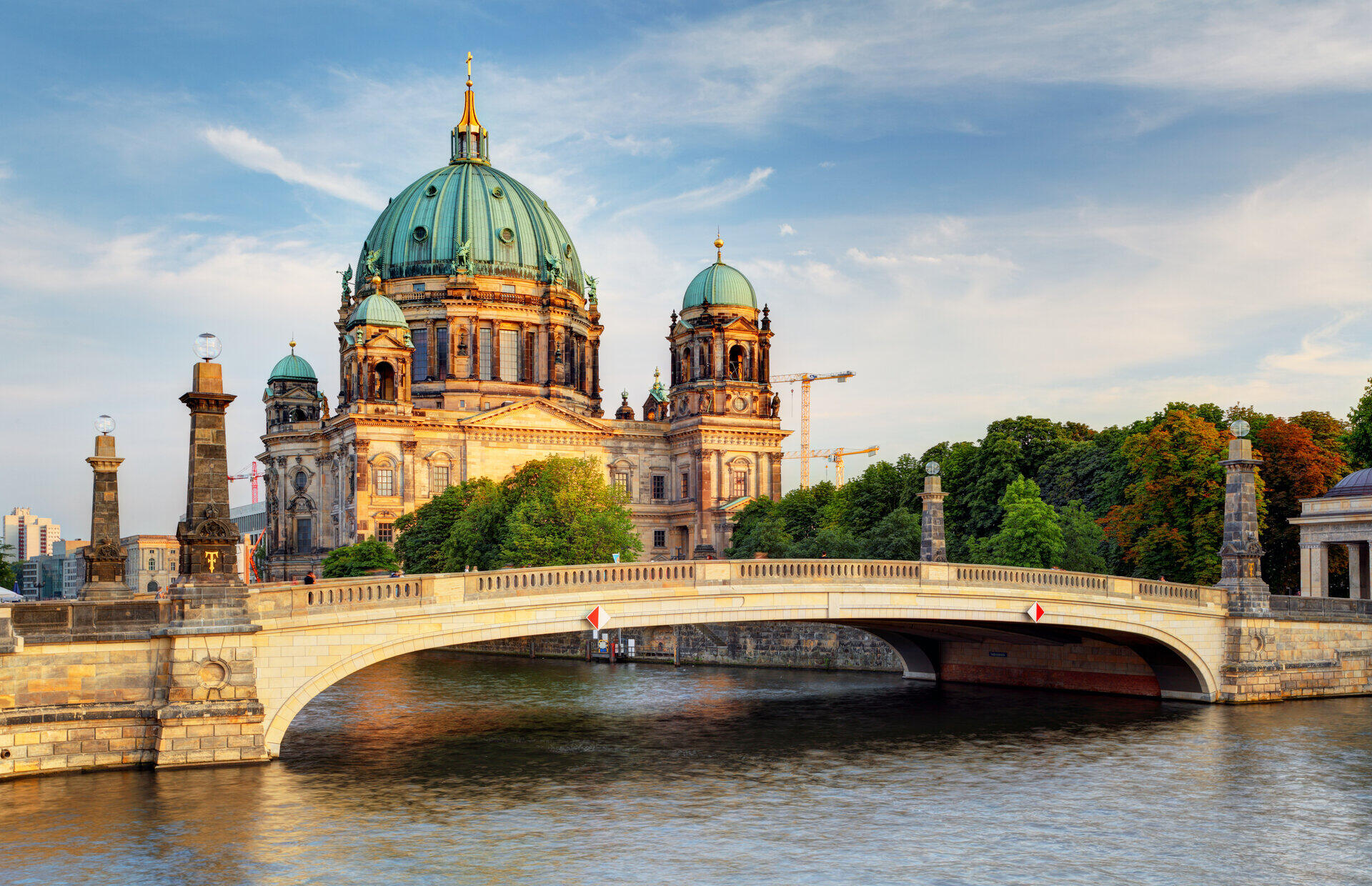 Berlin Cathedral and Friedrichsbruecke over the Spree river in evening light